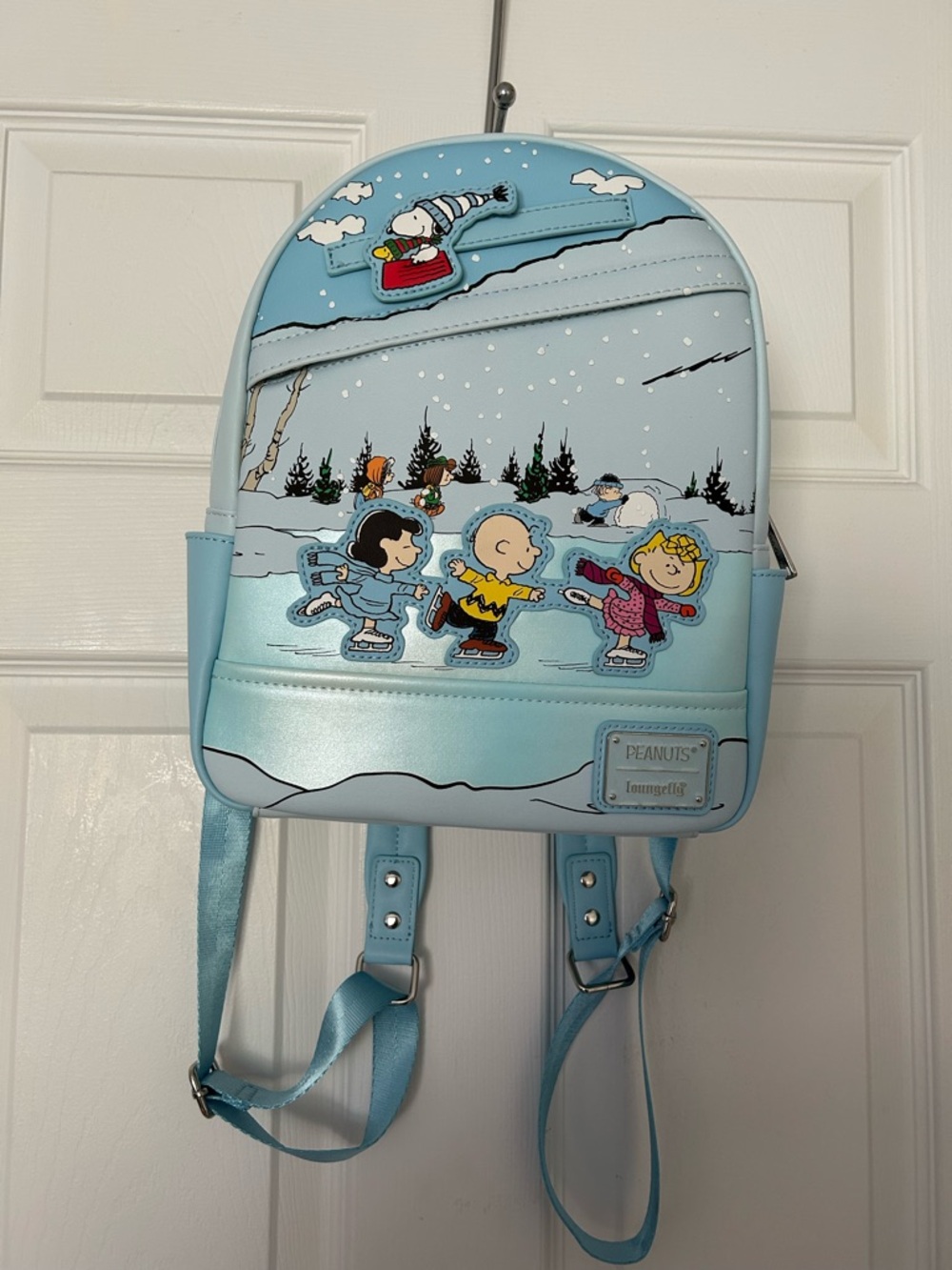 Loungefly Light Blue Peanuts Ice Skating Mini Backpack